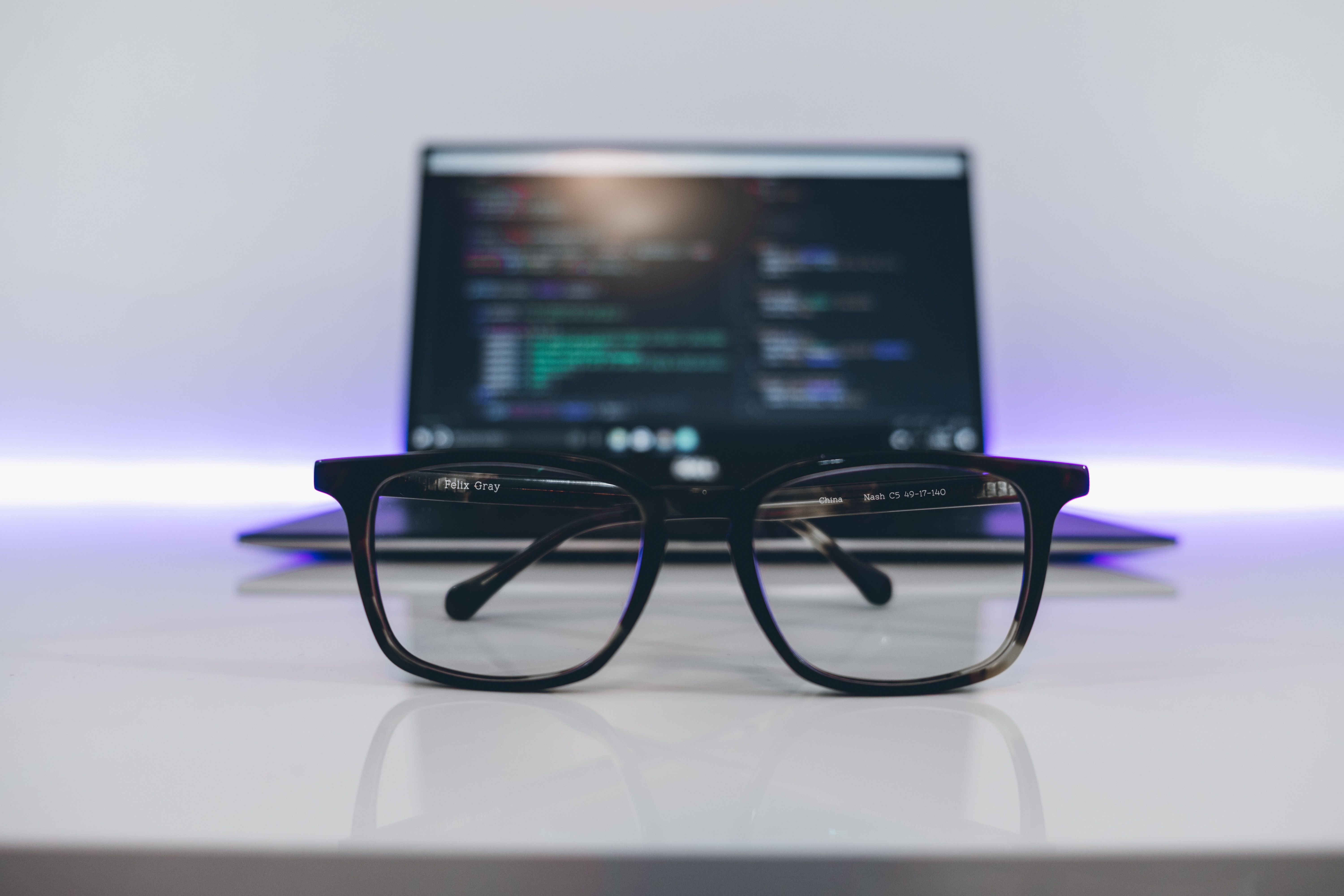 Glasses in front of a laptop screen