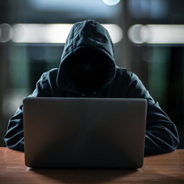 hacker-in-front-of-laptop-wearing-sweatshirt